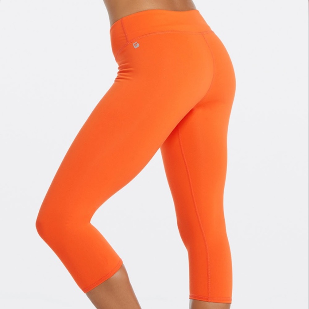 Fabletics orange mid rise power hold cropped pants